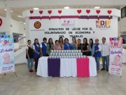 Donación de leche por el Voluntariado de Economía y del Trabajo